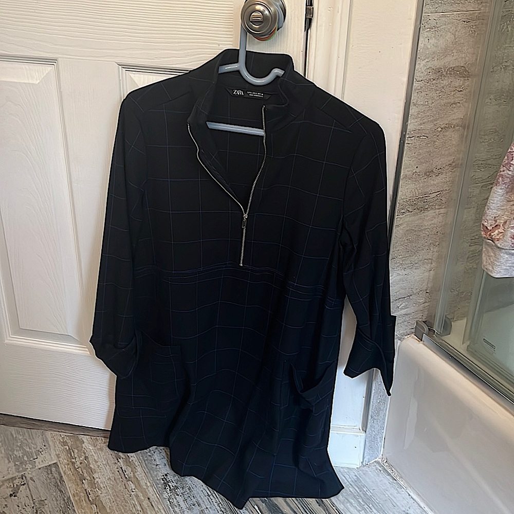 Black and navy blue plaid dress with zipper collar.
